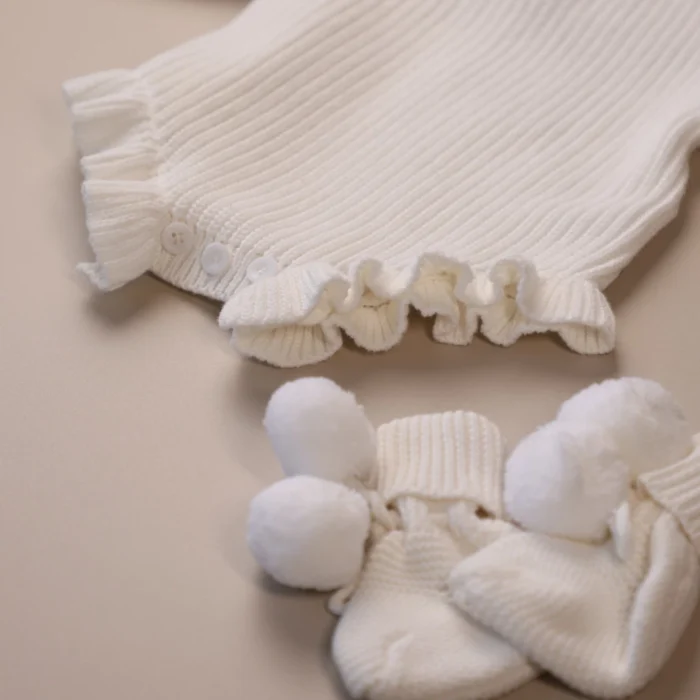 white_knit_ruffle_romper_buttons_detail white_knit_ruffle_romper_buttons_detail